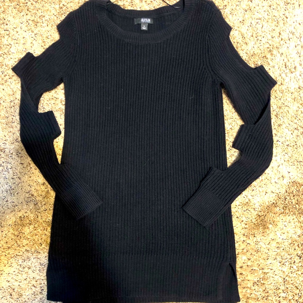 Small dress with arm holes in sleeves. Never worn.